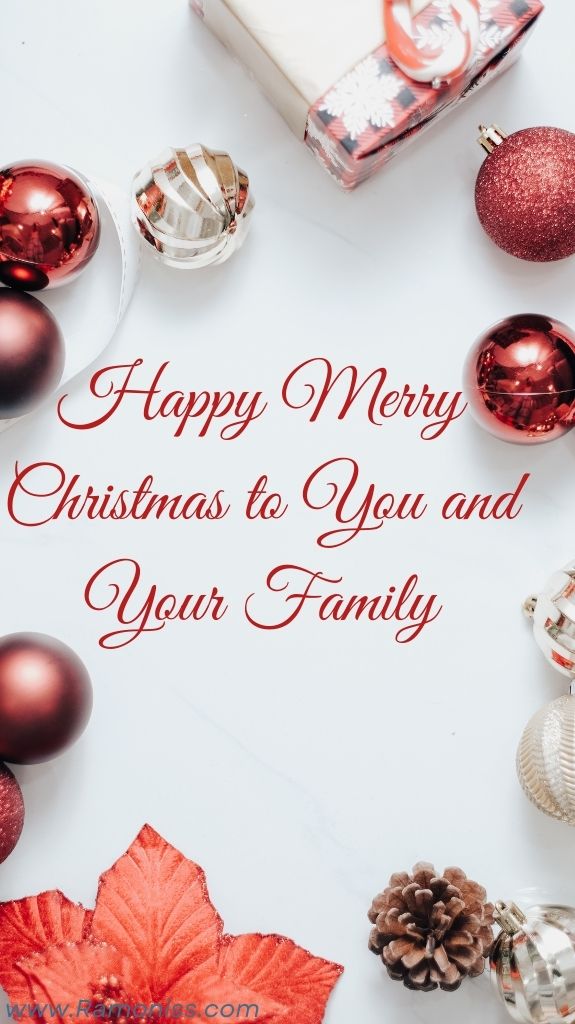Christmas balls and gifts are placed on a white background, the photo reads "happy merry christmas to you and your family" using stylish fonts in red