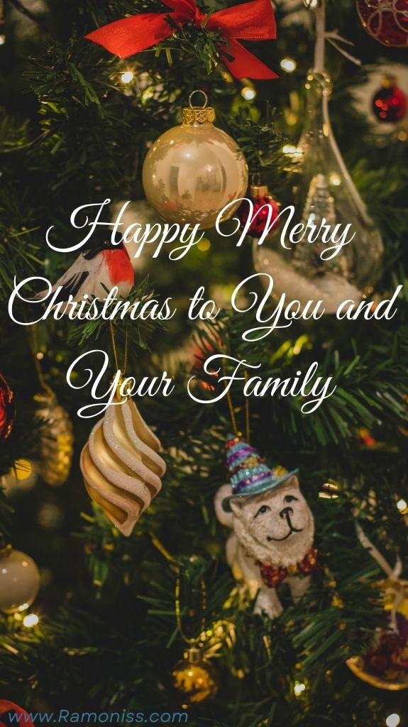 The christmas tree is decorated with christmas balls, ribbon and gifts, and the words "happy merry christmas to you and your family" are written in stylish white fonts.