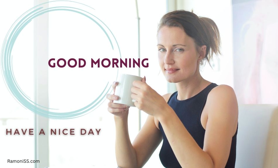 In the photo, a girl wearing a black top is sitting and holding a cup of tea in her hands, and in the photo is also written good morning "have a nice day".