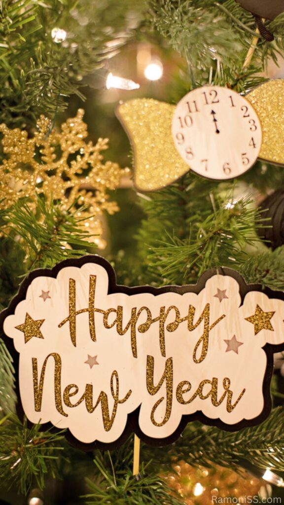 Happy new year 2023 card image template in yellow font, decorated with the help of christmas tree, clock and happy new year plastic items.