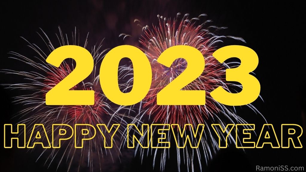 Happy new year 2023 on black background with bright colorful fireworks in the sky using yellow color font.