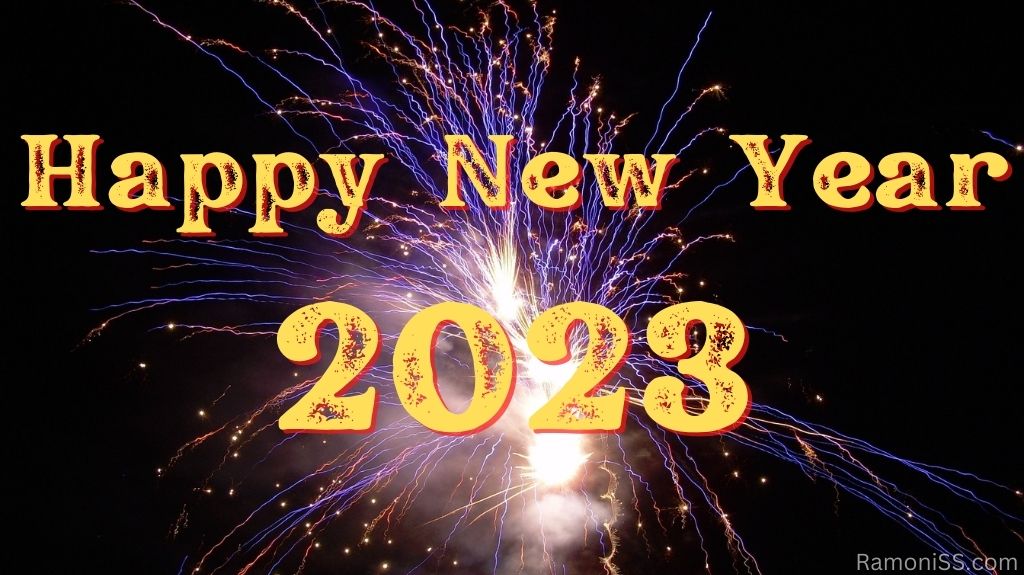 Happy new year 2023 on black background with bright colorful fireworks in the sky using yellow color font.