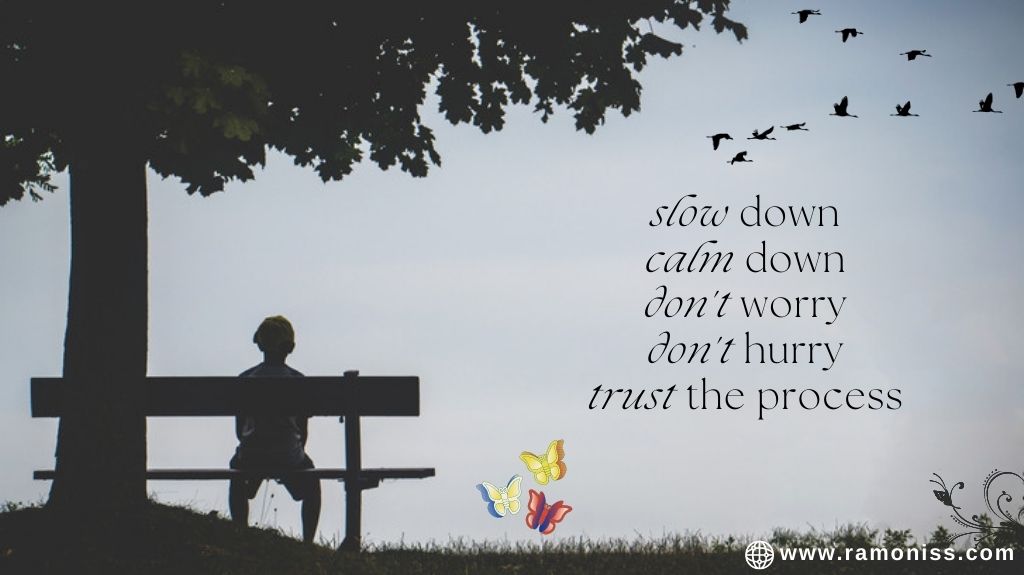 A little boy sitting on a street chair under a tree, inspirational thought is also written in the image slow down, calm down, don't worry, don't hurry, trust the process.