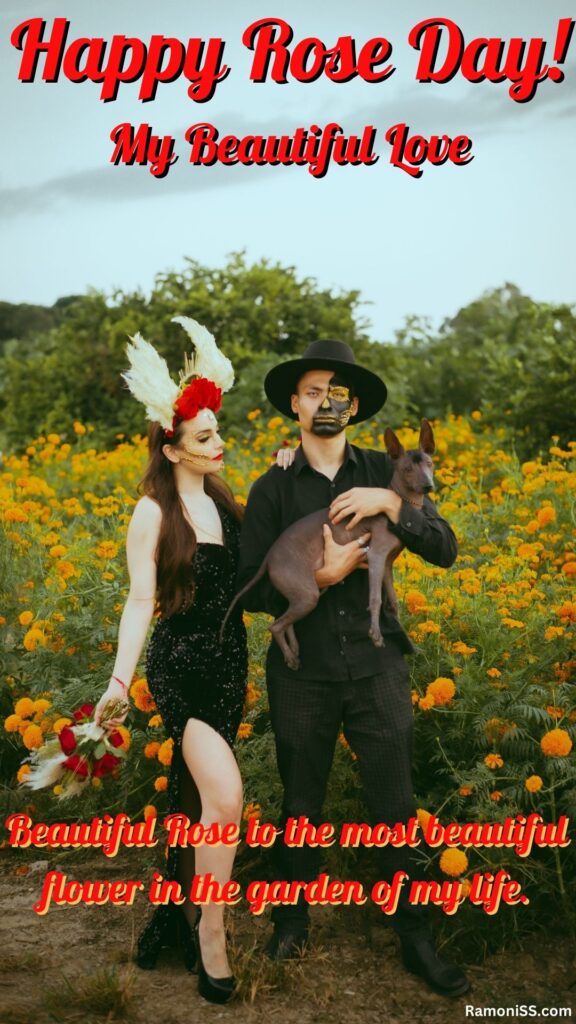 A boy and his beautiful girlfriend dressed in black are standing in a flower garden the boy is holding a puppy and his girlfriend is holding roses