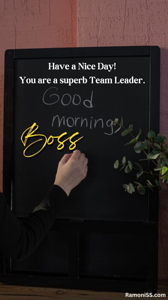 Good morning boss is written in the image and in the background image a blackboard, and chalk are in the hand.