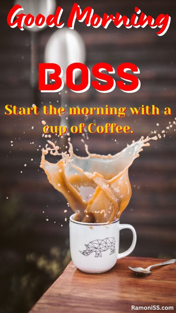 Good morning boss written in the image and in the background image a cup of spilled tea and a spoon is placed on the wooden table.