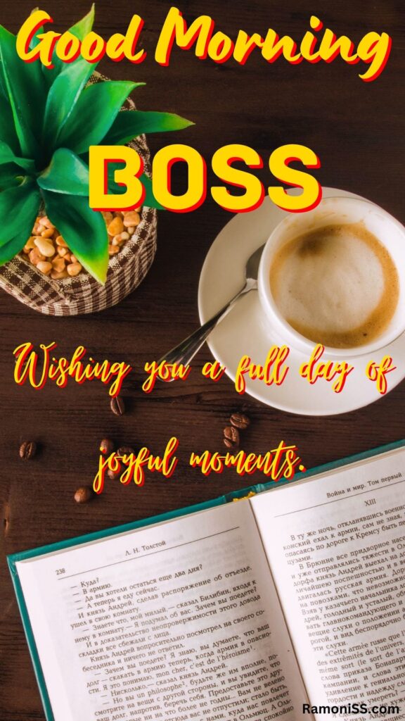 Good morning boss written in the image and in the background image a cup of tea, a spoon, a book, and an artificial pineapple are placed on a wooden table.