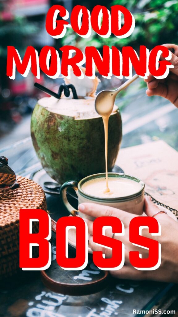 Good morning boss written in the image and in the background image a full cup of coffee, and coconut water are placed on a table.