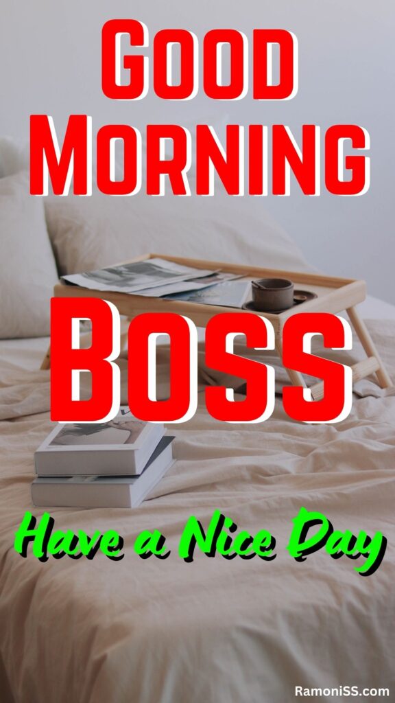 Good morning boss written in the image and in the background image there are two books on the white bed and a coffee cup, newspapers, and a plate on a small table.