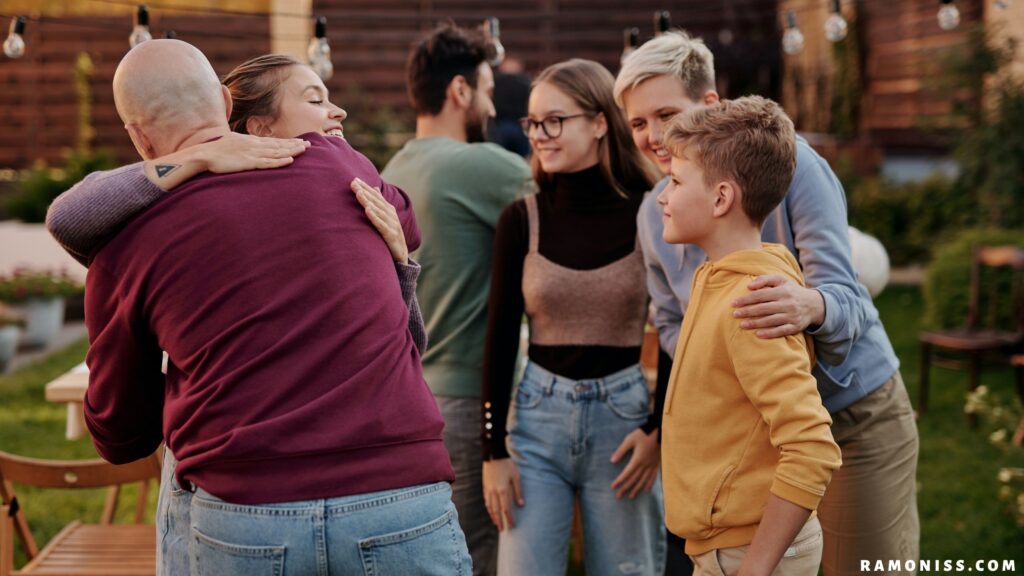 In the photo, a happy family has met after a long time, and is hugging each other.