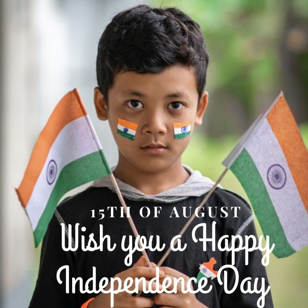 In the picture, a child is holding two indian flags and it is also written 15th of august wish you a happy independence day.