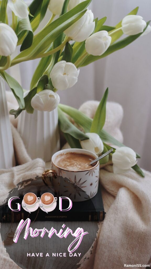 Flower in the flowerpot and a cup of coffee on the table good morning "have a nice day" instagram status