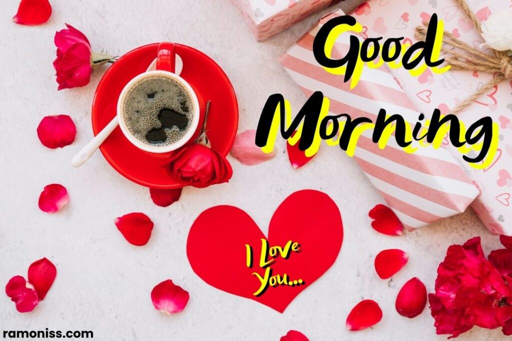 Heart print paper wrapped gifts rose flower petals cup of coffee placed on the white surface good morning love images.