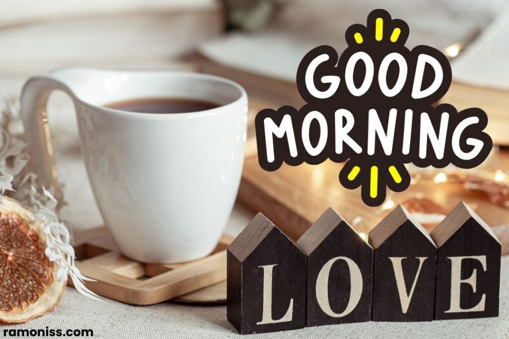 Cosy home composition with the decorative word love and cup of coffee blurred background with bokeh good morning love images for my girlfriend.